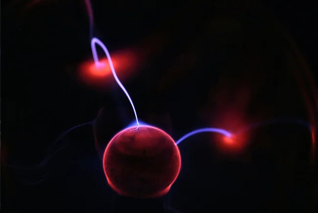 An abstract image of an atom, representing the law of attraction physics.